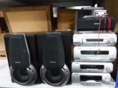 A Technics four piece separates system with remote together with five speakers