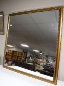 A square gilt framed mirror
