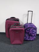 Two Pierre Cardin luggage cases together with one other