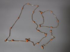 Two antique yellow metal necklaces with coral studded beads CONDITION REPORT: The