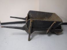 A wooden wheel barrow