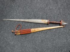 A central African tribal sword in leather sheath