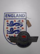 Two cast metal plaques;