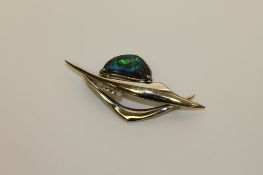An 18ct white gold opal and diamond brooch, 9.