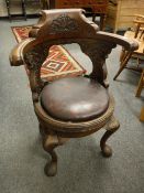 An early twentieth century oak ship's chair,