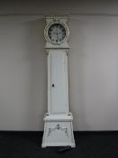 A continental white and gilt painted longcase clock with pendulum and weight CONDITION