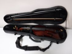 A violin and bow in a Gewa hard case