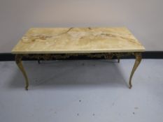 A gilt and onyx effect coffee table