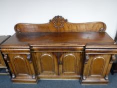 A Victorian mahogany four door inverted breakfront sideboard