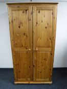 A pine double door wardrobe