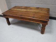 A Mexican pine coffee table with metal mounts