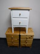 A pair of pine three drawer bedside chests together with a two drawer bedside chest