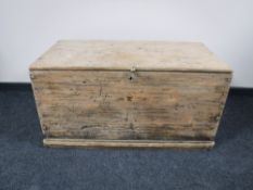 A stripped antique pine blanket box