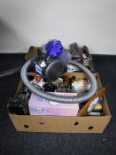 A Dyson DC 26 cylinder vac, storage ottoman, two boxes of tea china, glass ware,