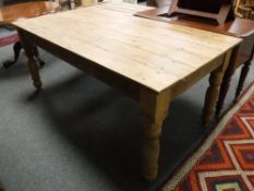 A rustic pine farmhouse dining table, length 6'.