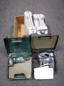 Four cased power tools including Black and Decker jigsaw, Bosch sander,
