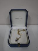 An amethyst pendant on 9ct gold chain