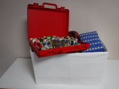 A lidded box containing sewing equipment