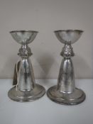 A pair of Lindisfarne silver candlesticks, Reid & Sons, height 13cm,