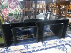 A contemporary black glass coffee table,