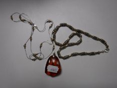 A silver set amber pendant together with two silver and gilt necklaces