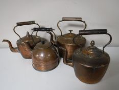 Four antique copper kettles