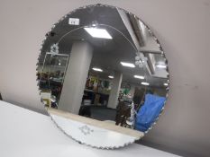 An early twentieth century circular frameless mirror