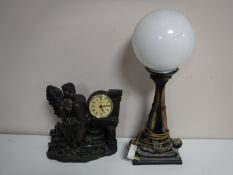 A contemporary Art Deco style table lamp with glass shade,
