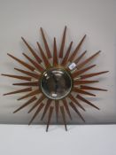 An Anstey and Wilson teak sun burst clock