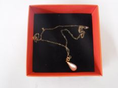 A 9ct gold mounted pearl pendant on chain