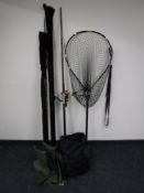 Three fishing rods including a Shakespeare salmon rod and beach casters together with a pair of