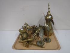 A tray containing brass ware including ornaments, kettle,
