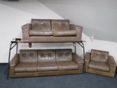 A late twentieth century Danish brown leather three piece suite, comprising of three seater settee,