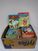A box containing late twentieth century annuals, including Beano, Dandy,