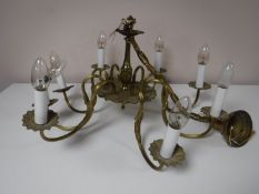 A continental brass eight way chandelier
