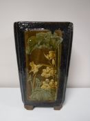 A Chinese earthenware glazed planter with panels depicting bamboo and birds, height 44 cm.