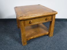 A contemporary two-tier lamp table fitted a drawer