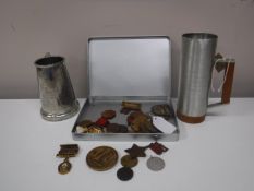 An interesting collection of thirty one badges and medals relating to athletics, swimming, sailing,