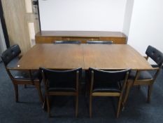 A mid twentieth century eight piece teak dining room suite, comprising of sideboard,