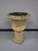 A concrete garden urn