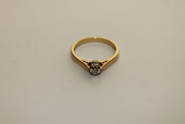 An 18ct gold diamond solitaire ring, approximately 0.25ct, size M.