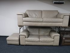 A beige leather three seater settee, two seater settee,