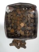 A tin containing a quantity of Georgian pennies and assorted coinage