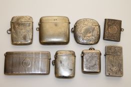 A collection of silver vesta cases and a card case CONDITION REPORT: Most pieces