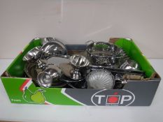 A box containing stainless steel dinner wares