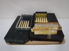 An oak cased canteen of cutlery and other boxed sets of flatware cake server, knives and forks,