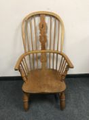 An antique elm Windsor armchair