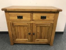 A good quality oak two drawer side cabinet,