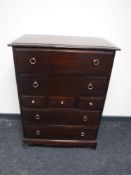 A Stag Minstrel seven drawer chest in a mahogany finish
