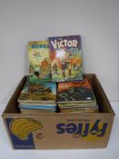 A box containing late twentieth century annuals, including Victor For Boys, Tom and Jerry,